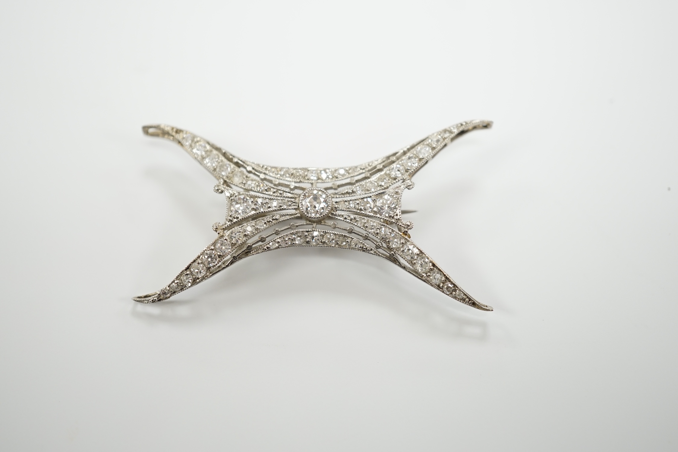 A 1920's white metal and millegrain set diamond cluster set brooch, 46mm, gross weight 5.2 grams.